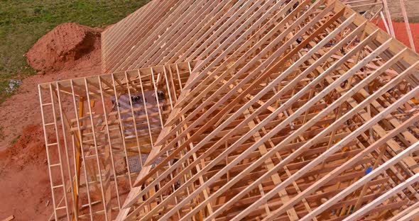 Aerial View the Wooden Construction of Roof Framing Beams Trusses a House