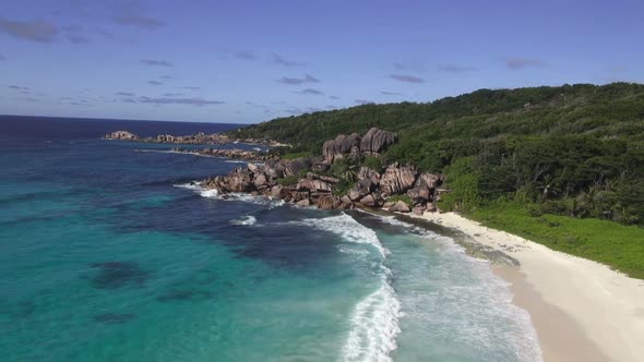 Aerial View Wavy Ocean and Tropical Island