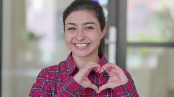 Portrait of Indian Woman Showing Heart Sign By Hand