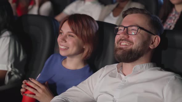 Laughing Couple Enjoying Comedy Cinema