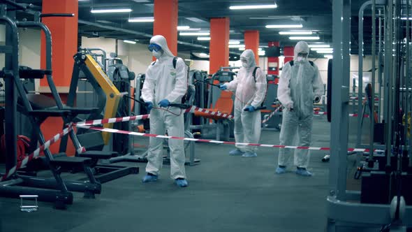 Group of Experts Are Disinfecting Fitness Center