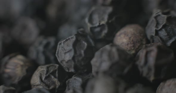 Macro of Peppercorns on a white plate