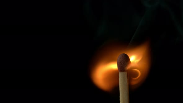 Super Slow Motion Macro Shot of Igniting Match Against Black Background at 1000Fps