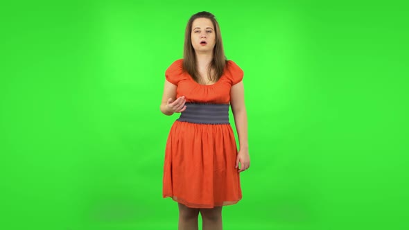 Cute Girl Cooling Herself By Her Hand, Suffering From High Temperature Weather. Green Screen