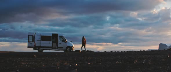 Man walks toward travel van