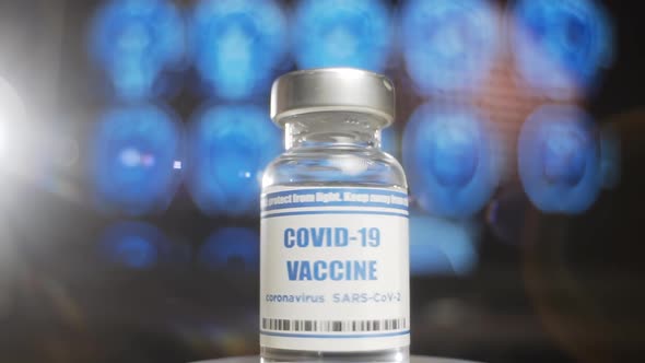 Ampoule of COVID-19 vaccine epic presentation, coronavirus vaccination. Doctors invented vaccine