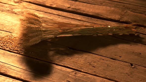 Bundle of Wheat Ears on Wooden Boards