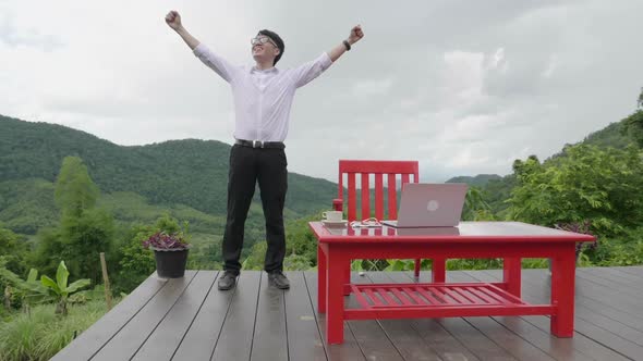 Asian Man Successful  With Beautiful Nature