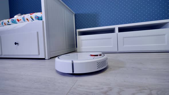 A Robotic Vacuum Cleaner Starts Its Routine From the Door