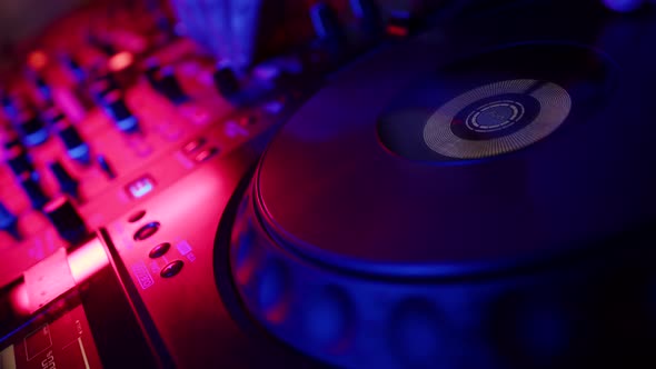 Closeup of Dj Mixer Controller Desk in Night Club Disco Party