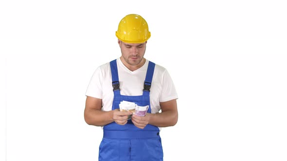 Builder Counting Money Standing on White Background