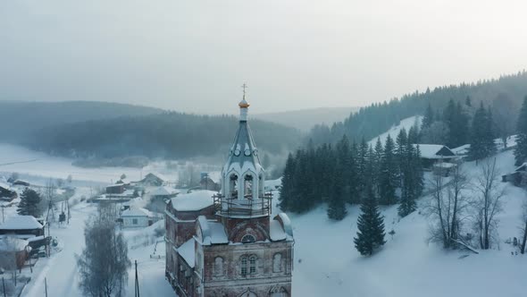 Aerial View of the Church in the Village in Winter