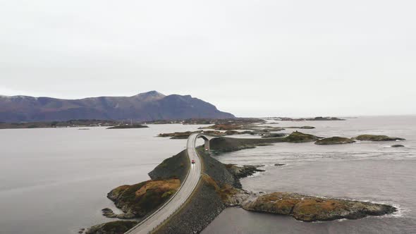 Car Driving On The Epic Atlantic Ocean Road. Storseisundet Bridge In Norway. Aerial