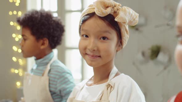 Portrait of Cheerful Asian Girl on Culinary Masterclass