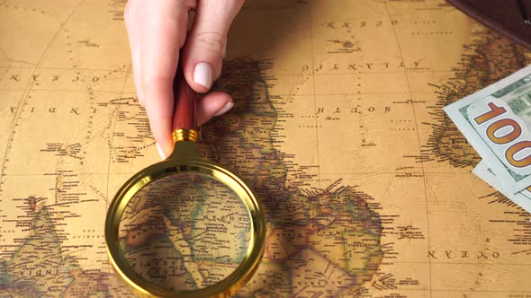 Examining the Map with a Magnifying Glass, Close Up
