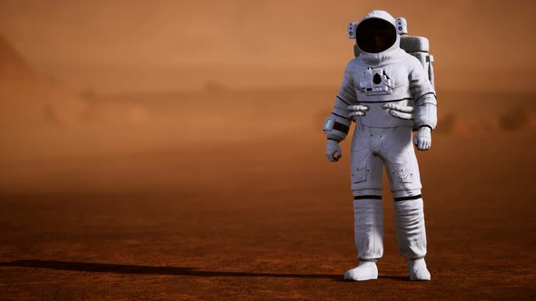 Astronaut on Mars Surface. Red Planet Covered in Gas and Rock alt