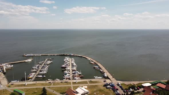 Yacht marina with motor and sails boats