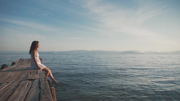 Young Girl On The Pier