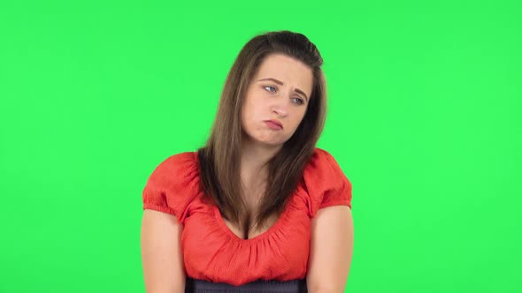 Portrait of Upset Girl Shrugging and Sighing. Green Screen