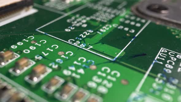 Extreme close-up of green Printed Circuit Board Electronics shot with dolly