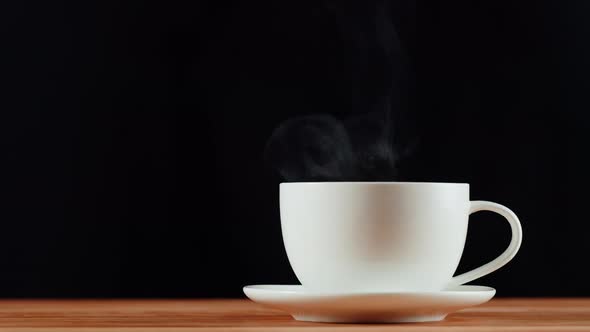Hot Drink in White Cup on a Wooden Table