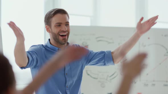 Happy Man Celebrating Success Colleagues Office