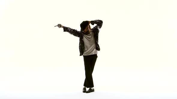 Young Stylish Teenager Is Showing Dance Moves Like Michael Jackson. Isolated Over White Background