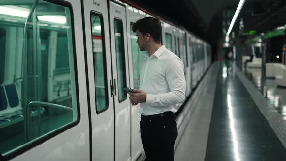 Male Entrepreneur Entering Subway Train