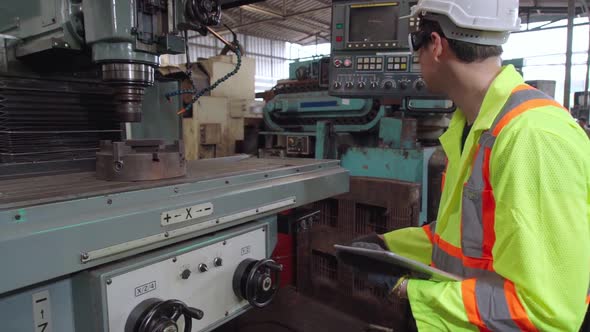 Smart Factory Worker Using Machine in Factory Workshop