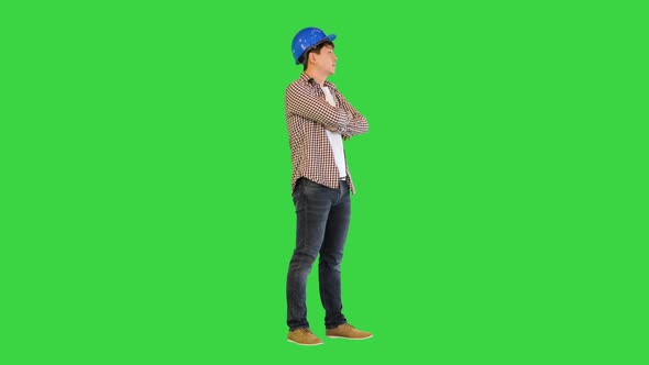 Confident Engineer Standing and Changing Poses on a Green Screen Chroma Key