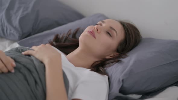 Woman Awake in Bed Thinking