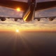 Airplaner retracts its landing gears as it flies away over the ocean. - VideoHive Item for Sale