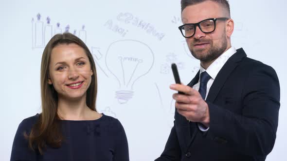 Man and Woman Shake Hands and Discuss the Business Strategy for Success in a Modern Glass Office