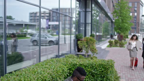 African Businessman Working on Laptop Outdoors