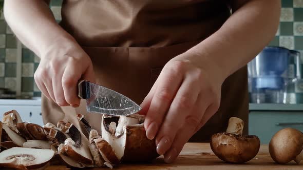 Woman Prepares Mushrooms in Home Kitchen