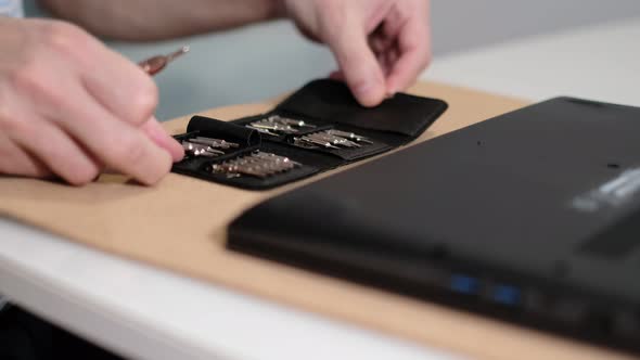 Unrecognizable Engineer Separating Computer From Case