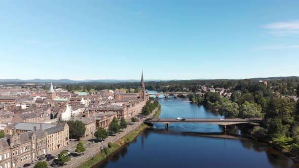 Beautiful calm summer day in Perth above the River Tay. Aerial shot drone descending