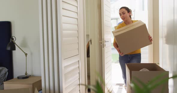 Happy caucasian couple in love moves into an apartment