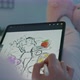 Female Designer Draws a Sketch on a Tablet Pc - VideoHive Item for Sale