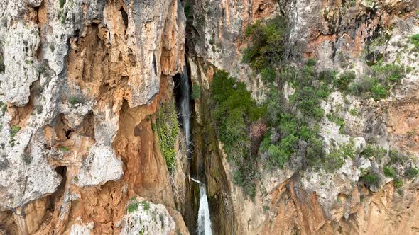 Waterfall in the mountains aerial view 4 K