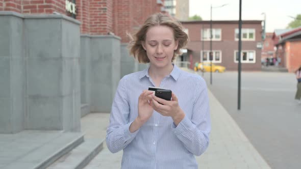 Woman Making Online Payment on Smartphone