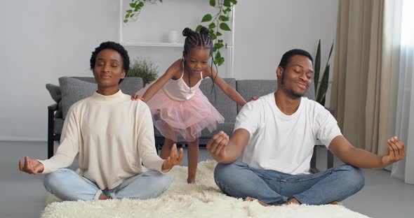 Young Couple Afro American Woman Moms and Black Man Dad Sit in Lotus Position Do Yoga Breathing