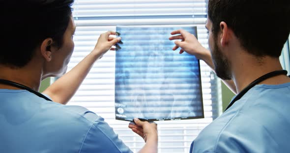 Two doctor studying a x-ray