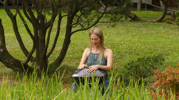 Blond Woman with Hung Having Rest Outdoors