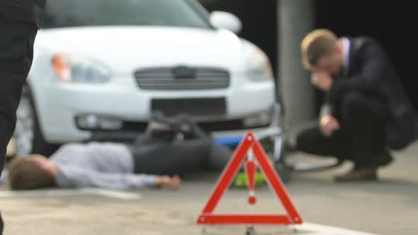 Police Worker Fencing Accident Scene by Caution Tape, Traffic Collision, Death