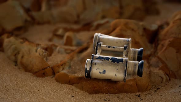 Old German Military Binoculars on the Sand Beach alt