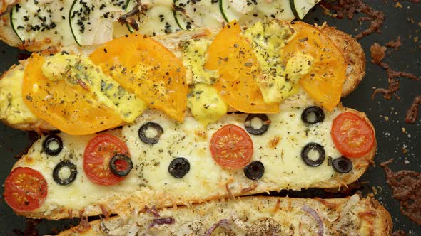 Composition of Hot Tasty Baked Sandwiches with Various Toppings. Cheese, Tuna, Mozarella, Spices