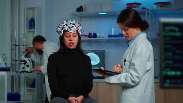 Stressed Patient Sitting on Neurological Chair with Eeg Headset