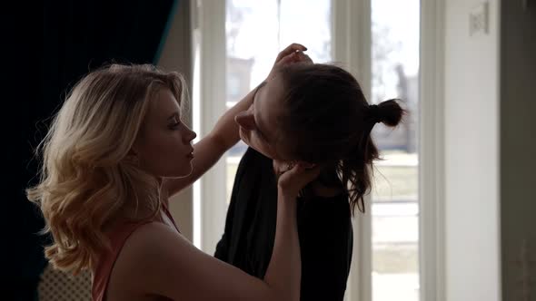 Portrait of a Young Couple in a Room with Large Windows