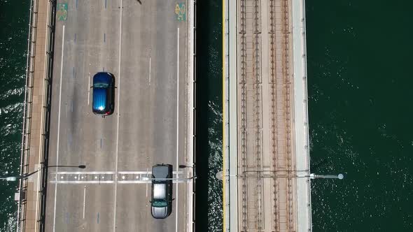 A view down on a bridge with vehicles travelling both ways